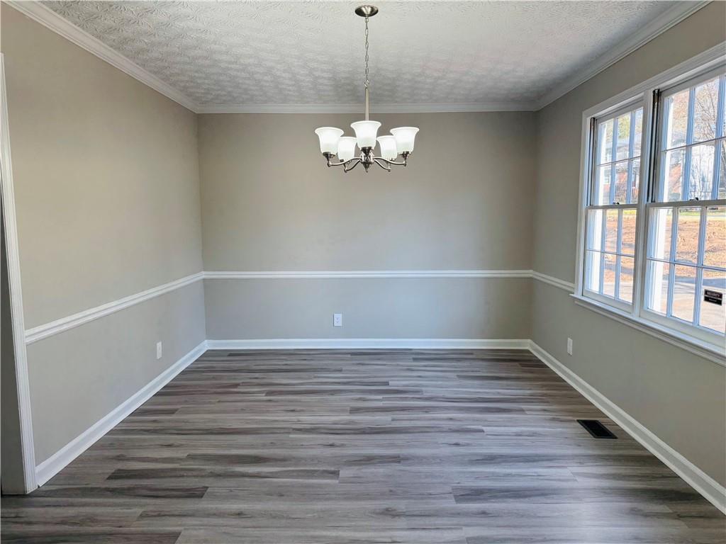 4795 Boxwood Way Northwest Acworth, GA 30102 - Photo 16 of 64 a view of a room with window wooden floor and windows