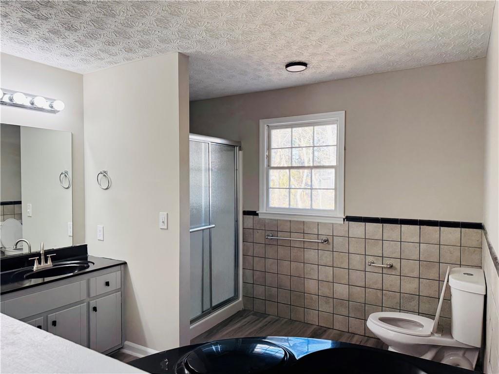 4795 Boxwood Way Northwest Acworth, GA 30102 - Photo 47 of 64 a bathroom with a sink a toilet and shower