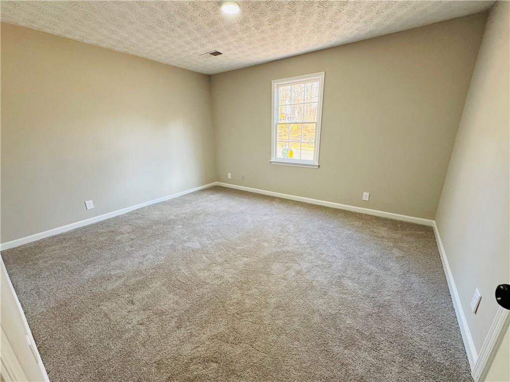 4795 Boxwood Way Northwest Acworth, GA 30102 - Photo 59 of 64 an empty room with a window