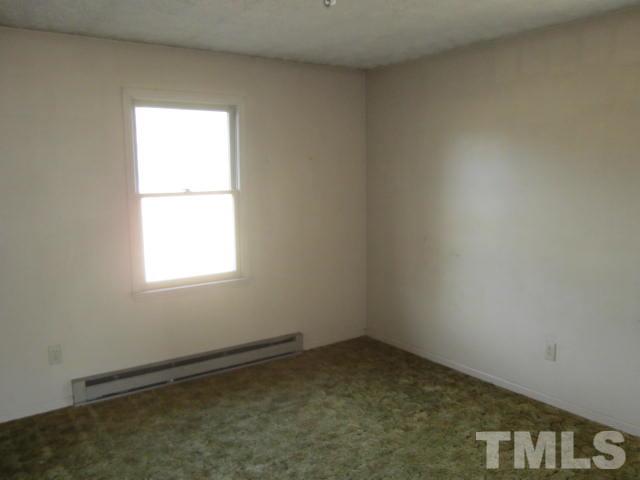 9276 Dirgie Mine Road Roxboro, NC 27574 - Photo 12 of 14 an empty room with a window