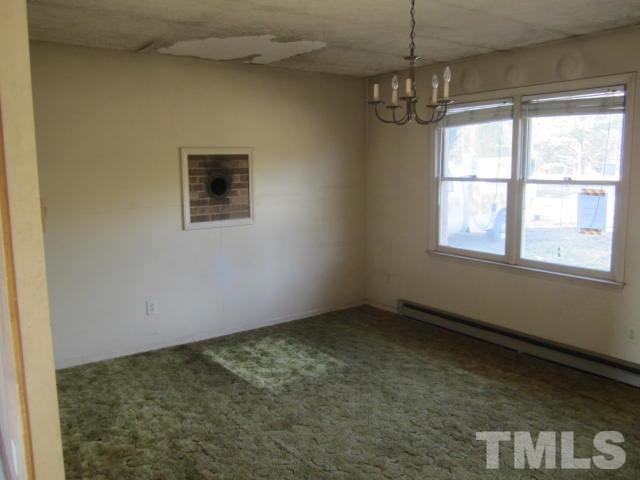 9276 Dirgie Mine Road Roxboro, NC 27574 - Photo 5 of 14 a view of an empty room with a window