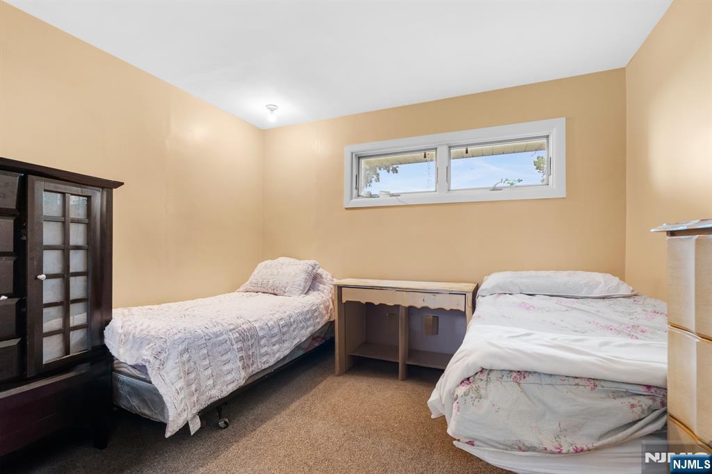 8 Hampton Road Clifton, NJ 07012 - Photo 12 of 16 a bedroom with a bed and a window