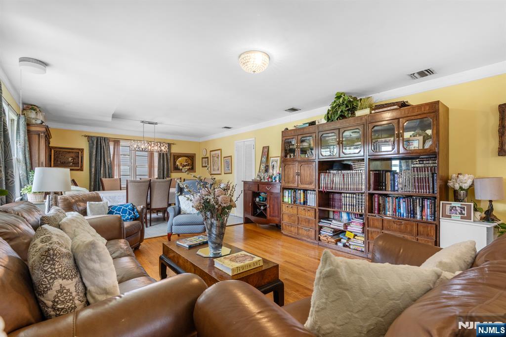 8 Hampton Road Clifton, NJ 07012 - Photo 3 of 16 a living room with furniture and a book shelf