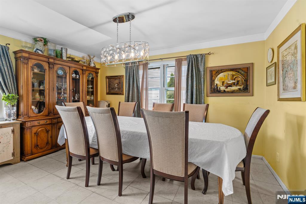 8 Hampton Road Clifton, NJ 07012 - Photo 5 of 16 a view of a dining room with furniture window and outside view