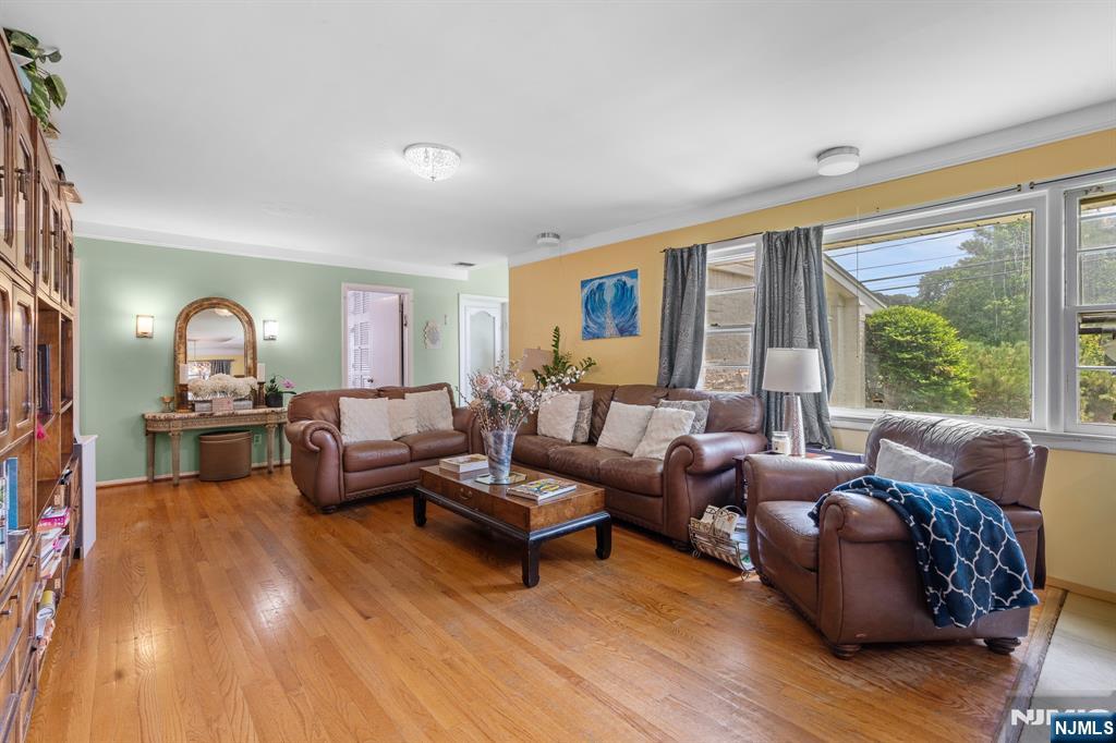 8 Hampton Road Clifton, NJ 07012 - Photo 6 of 16 a living room with furniture and a large window