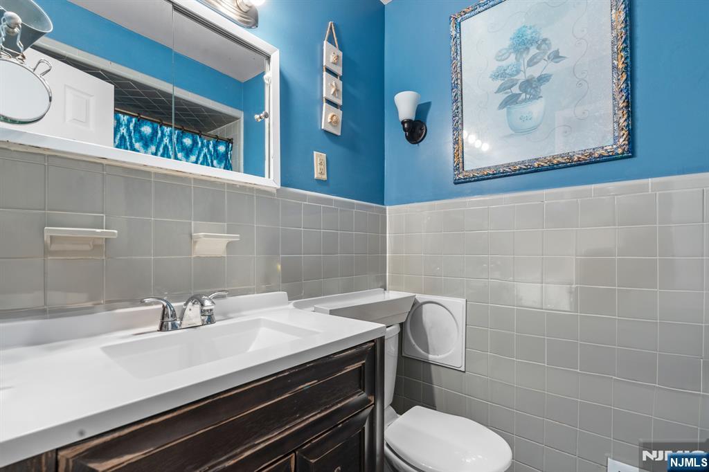 8 Hampton Road Clifton, NJ 07012 - Photo 10 of 16 a bathroom with a sink and a toilet