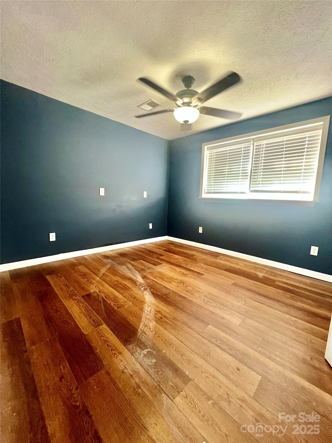 1182 Village Circle Hickory, NC 28602 - Photo 19 of 24 a bedroom with wooden floor and window