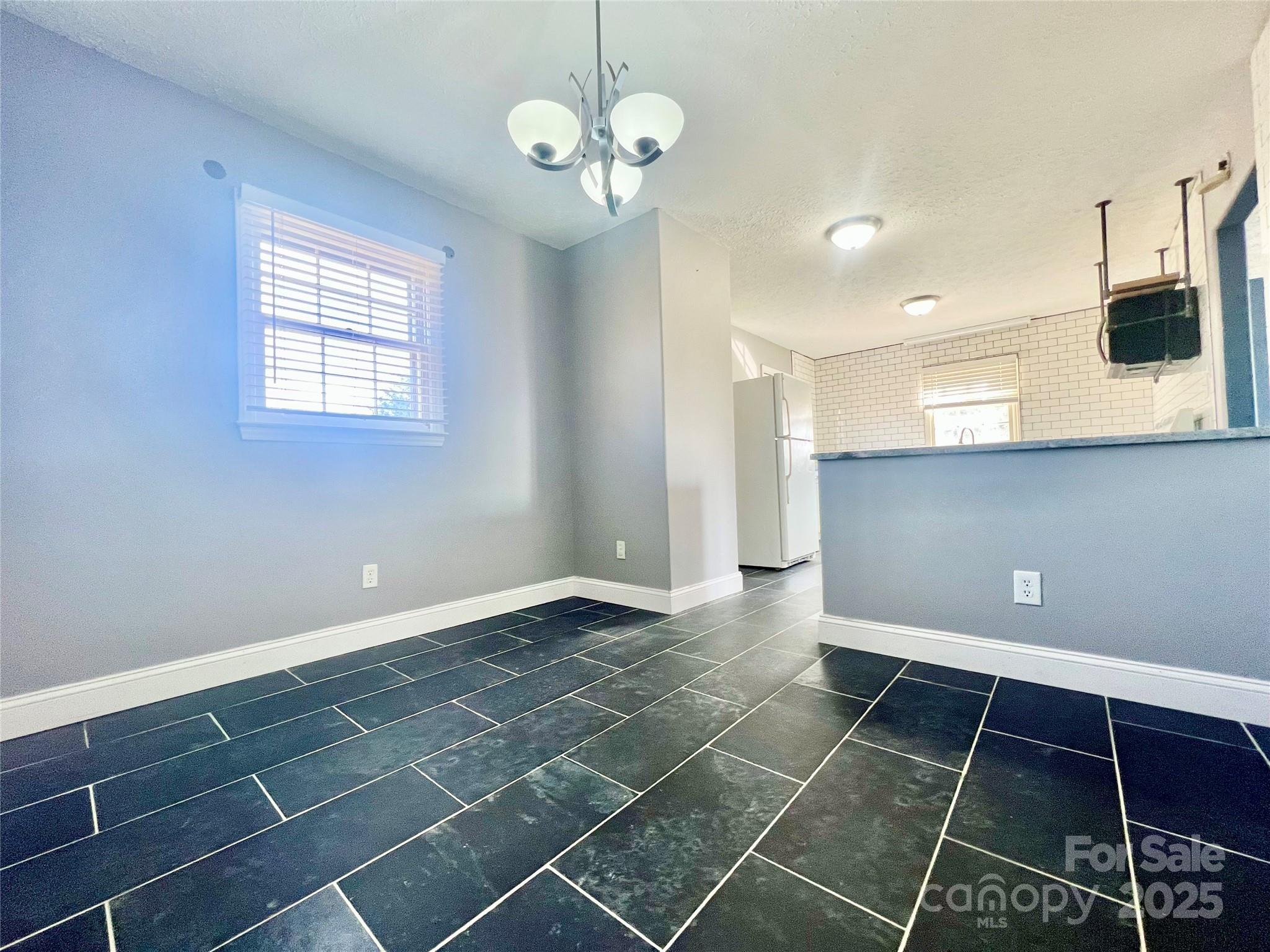 1182 Village Circle Hickory, NC 28602 - Photo 7 of 24 a view of an empty room with a window