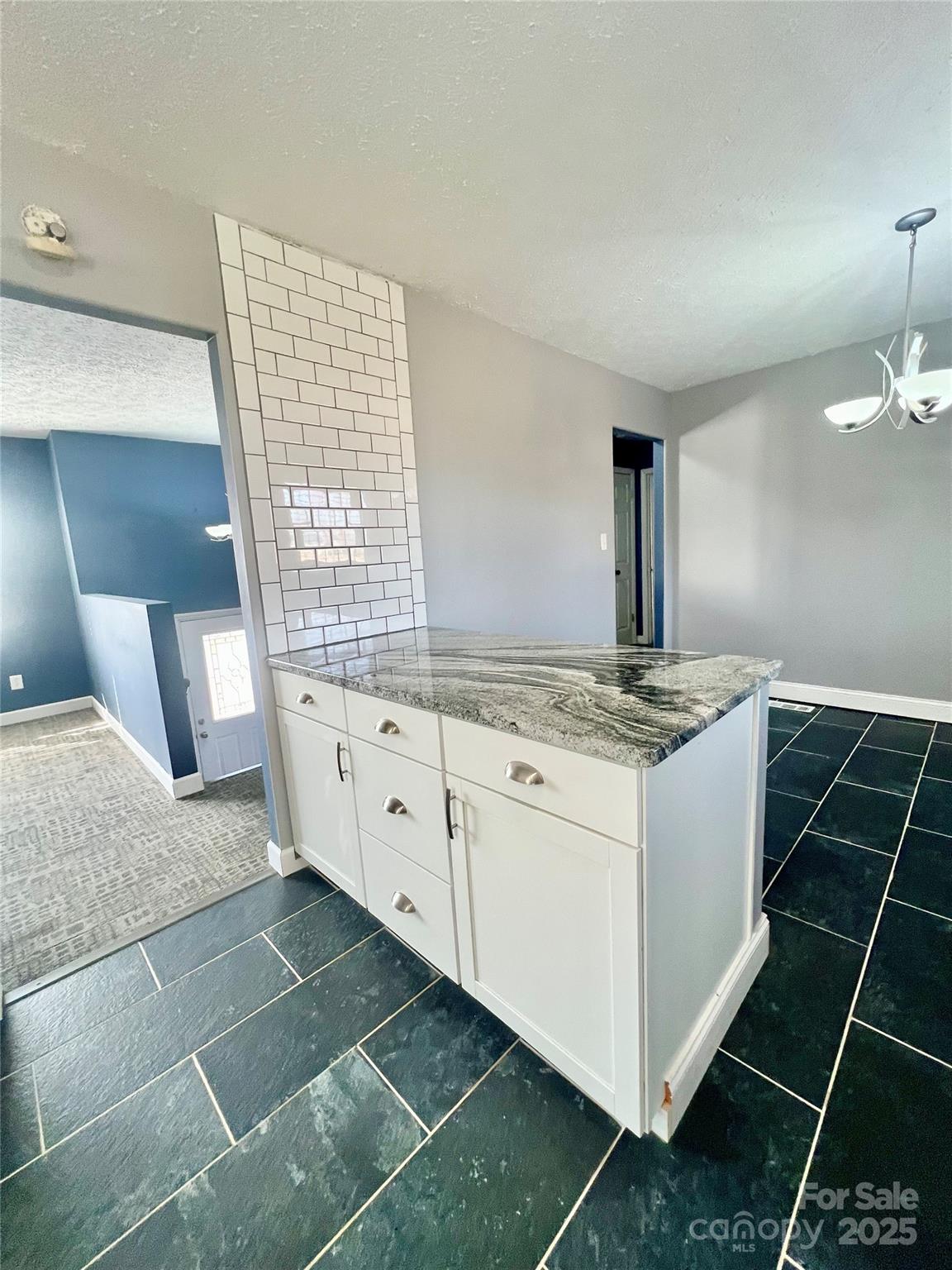 1182 Village Circle Hickory, NC 28602 - Photo 8 of 24 a kitchen with a sink and cabinets