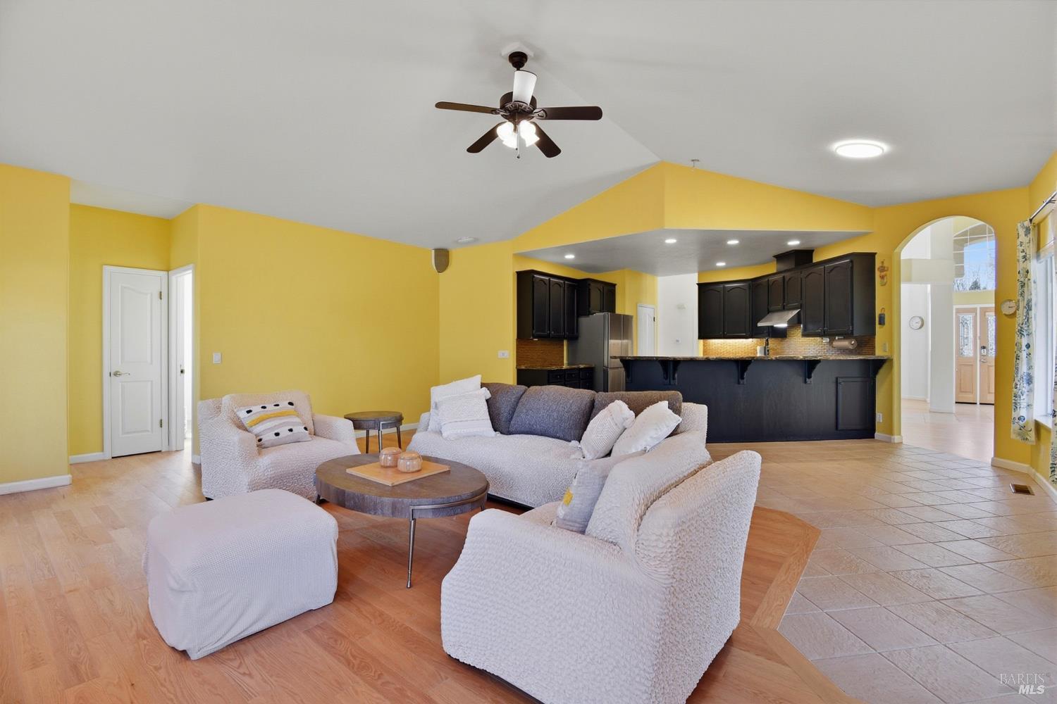 5828 Owl Hill Avenue Santa Rosa, CA 95409 - Photo 11 of 39 a living room with furniture and a chandelier