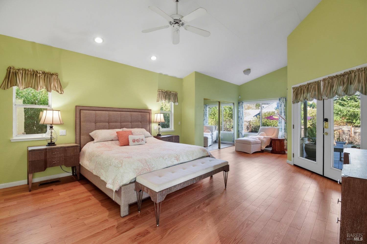 5828 Owl Hill Avenue Santa Rosa, CA 95409 - Photo 16 of 39 a spacious bedroom with a bed and glass door