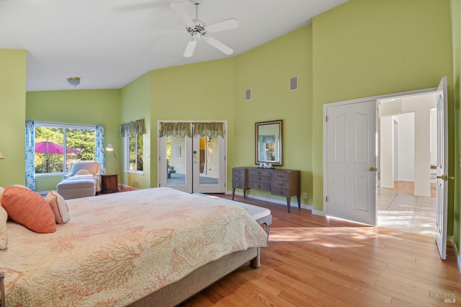 5828 Owl Hill Avenue Santa Rosa, CA 95409 - Photo 17 of 39 a spacious bedroom with a bed and dresser with mirror