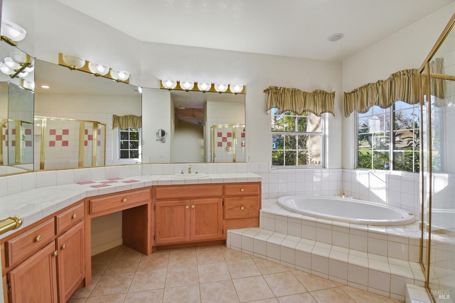 5828 Owl Hill Avenue Santa Rosa, CA 95409 - Photo 19 of 39 a spacious bathroom with a tub sink and mirror