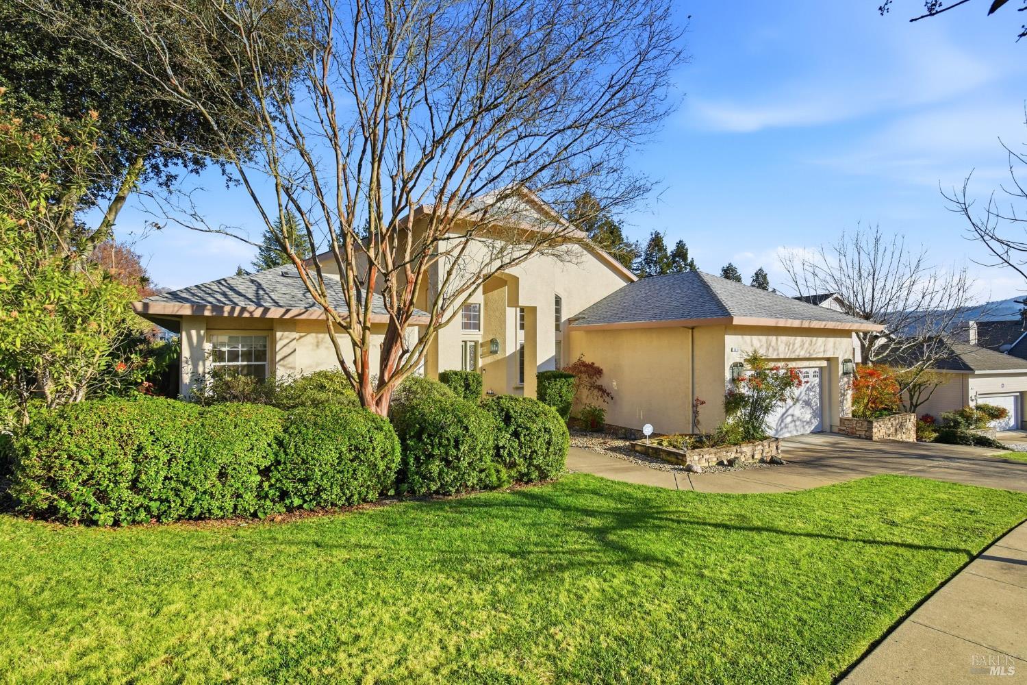 5828 Owl Hill Avenue Santa Rosa, CA 95409 - Photo 2 of 39 a view of a patio with table and chairs under an umbrella