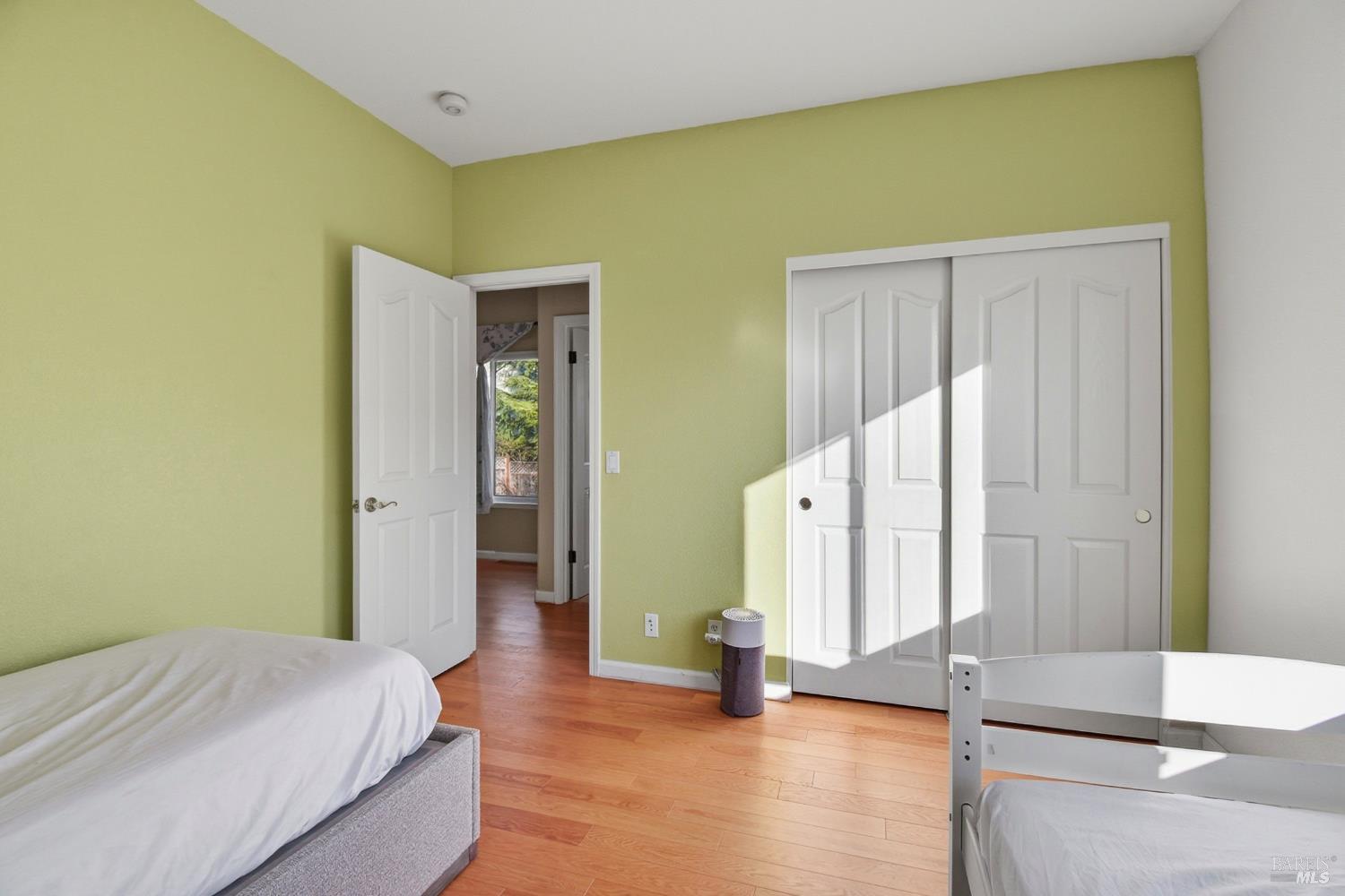 5828 Owl Hill Avenue Santa Rosa, CA 95409 - Photo 21 of 39 a view of a bedroom with wooden floor and stairs