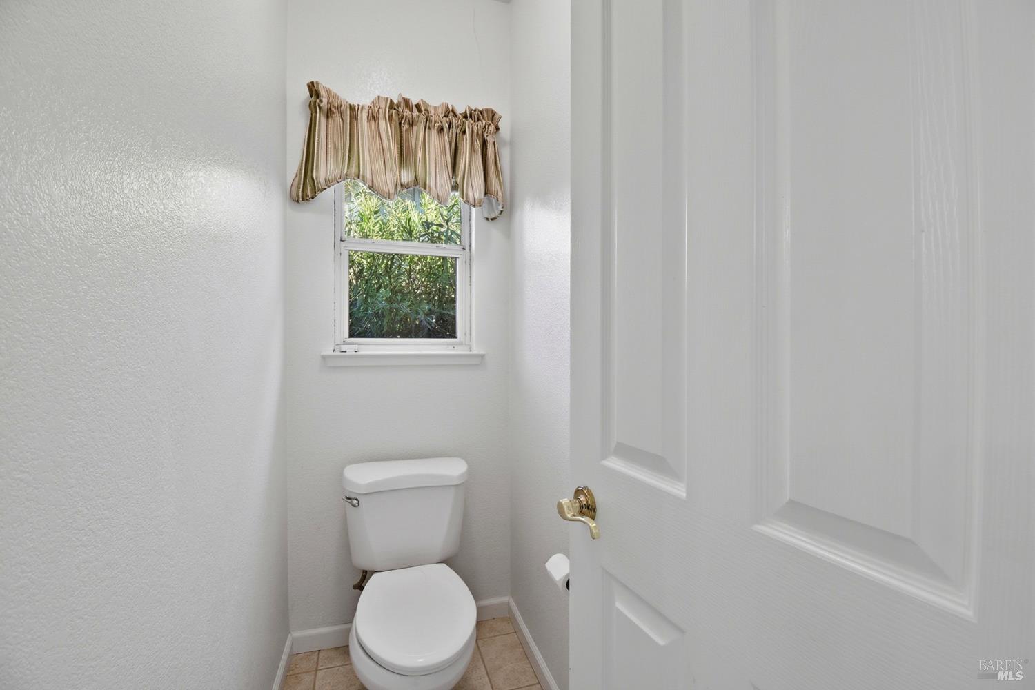 5828 Owl Hill Avenue Santa Rosa, CA 95409 - Photo 24 of 39 a white toilet sitting next to a shower