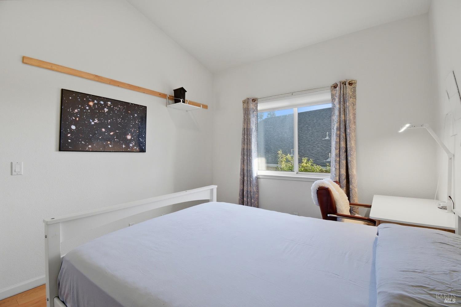 5828 Owl Hill Avenue Santa Rosa, CA 95409 - Photo 26 of 39 a bedroom with a bed and a large mirror