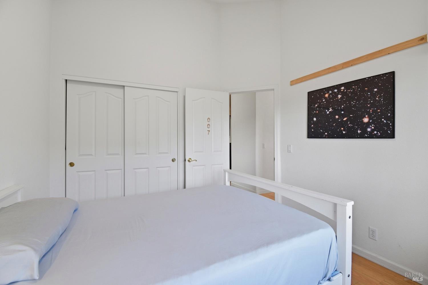5828 Owl Hill Avenue Santa Rosa, CA 95409 - Photo 27 of 39 a bedroom with a bed and a wall painting