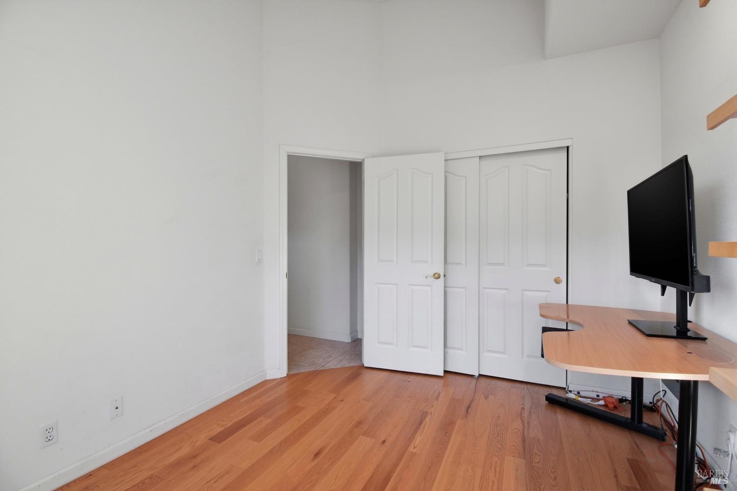 5828 Owl Hill Avenue Santa Rosa, CA 95409 - Photo 30 of 39 a bedroom with a bed and a flat screen tv