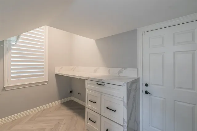 a view of cabinets and window