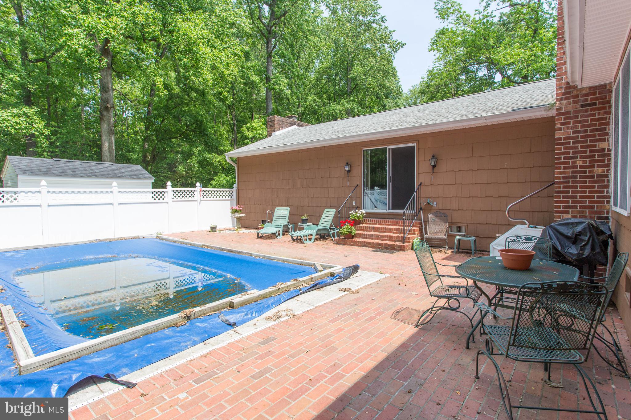 22167 Melson Road Georgetown, DE 19947 - Photo 12 of 38 a view of a patio with chairs and tables