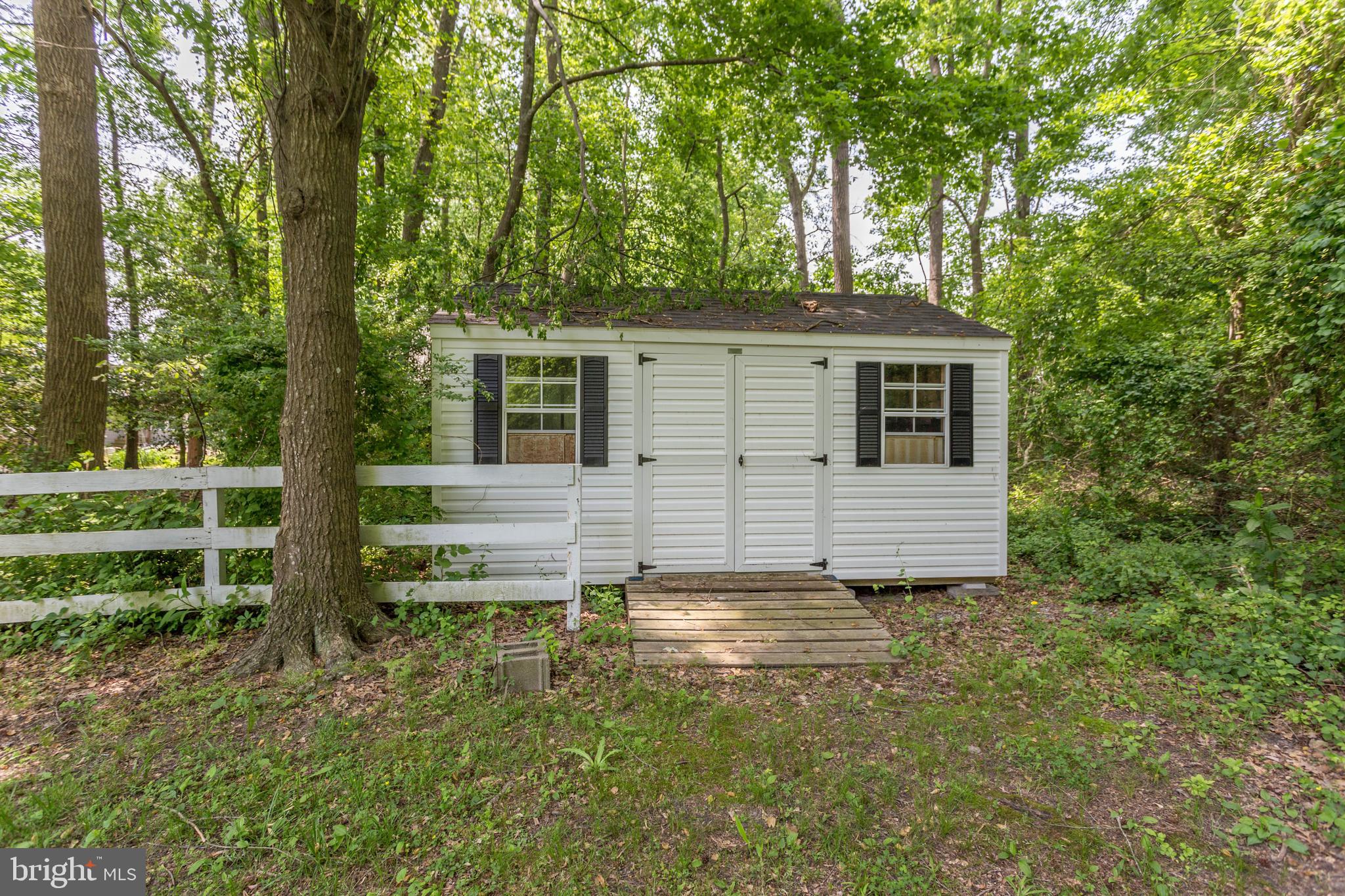 22167 Melson Road Georgetown, DE 19947 - Photo 15 of 38 a view of a house with a backyard
