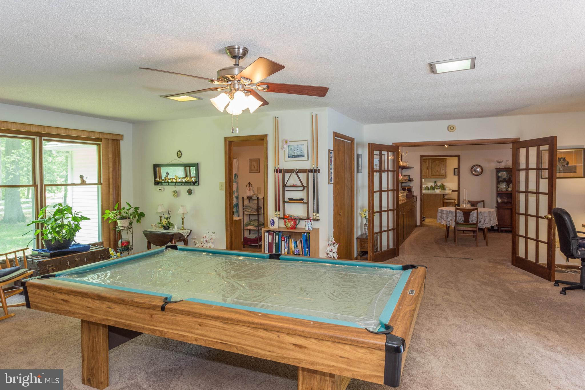 22167 Melson Road Georgetown, DE 19947 - Photo 17 of 38 a room with pool table and windows