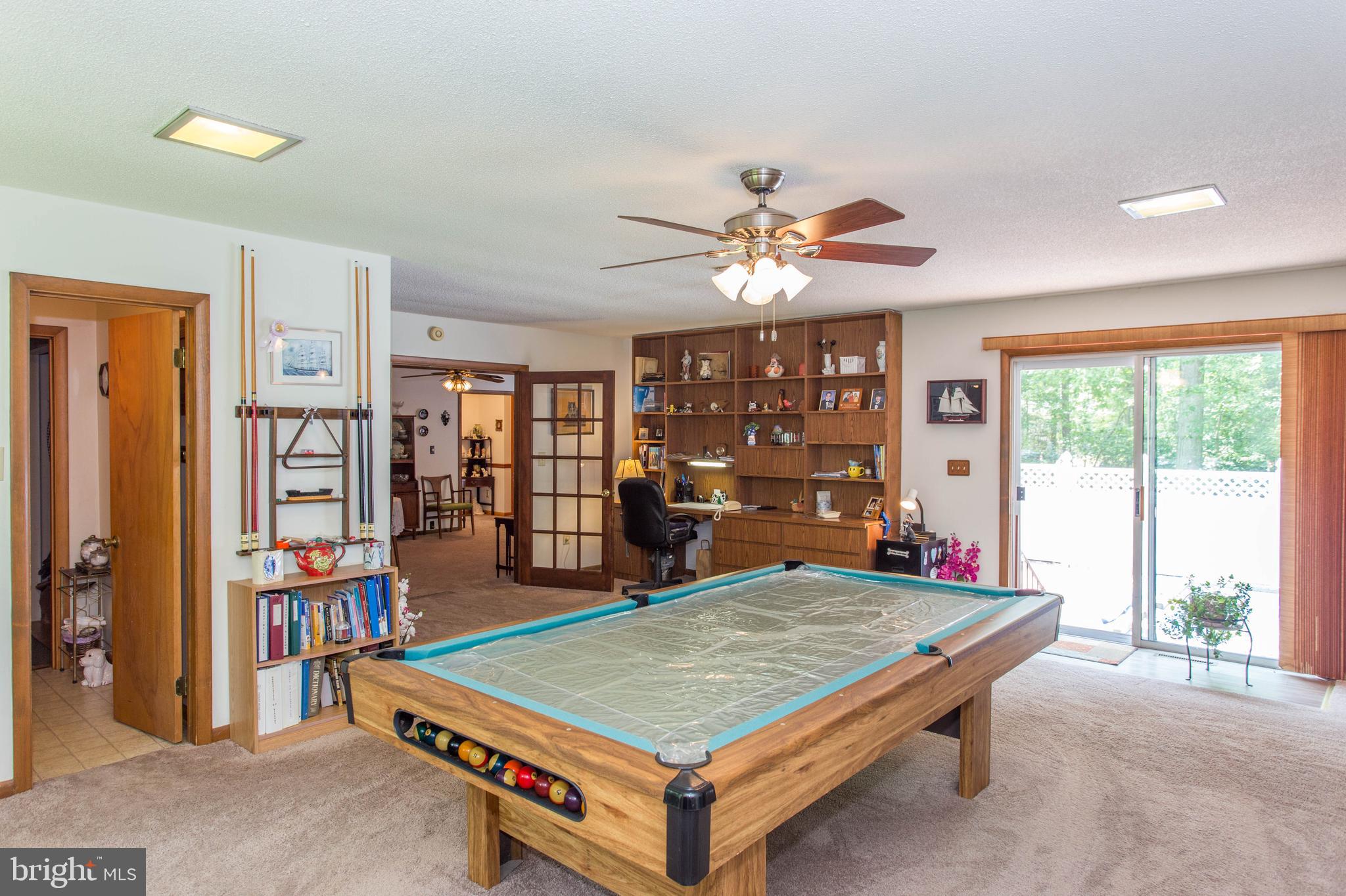 22167 Melson Road Georgetown, DE 19947 - Photo 19 of 38 a living room with furniture pool table and a large window