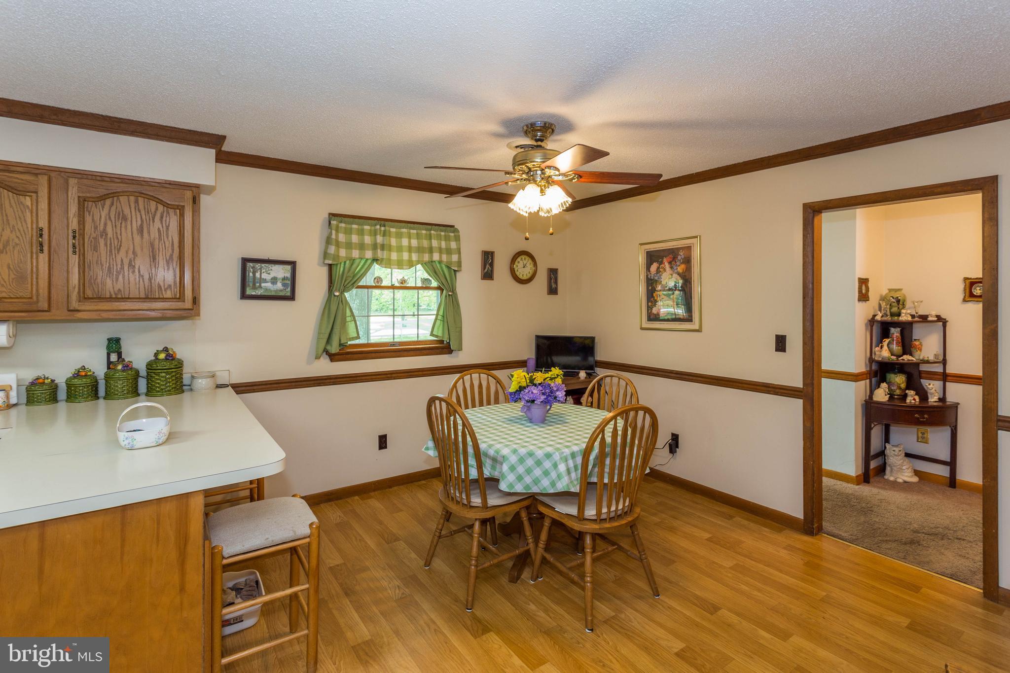 22167 Melson Road Georgetown, DE 19947 - Photo 20 of 38 a dining room with furniture and window