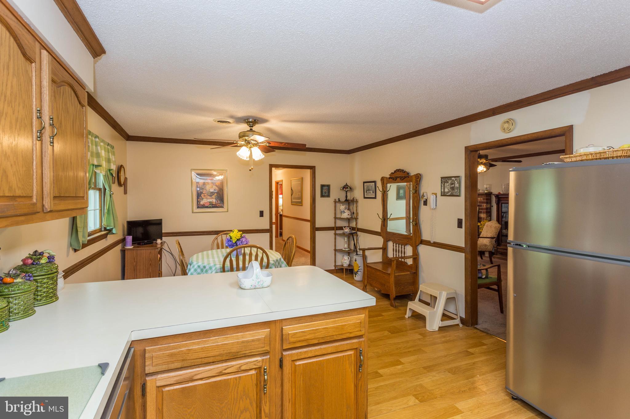 22167 Melson Road Georgetown, DE 19947 - Photo 27 of 38 a kitchen with a refrigerator and a sink