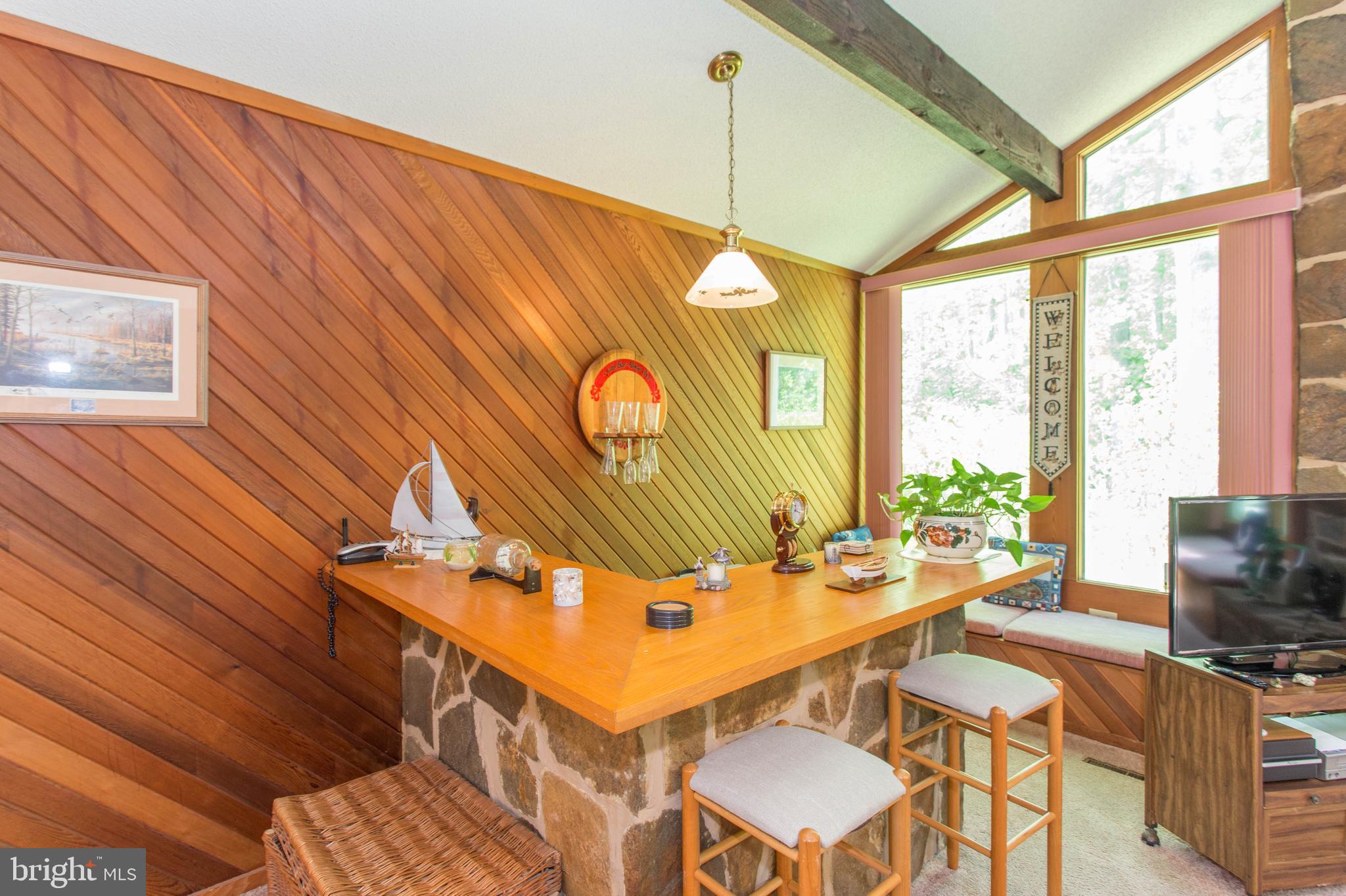 22167 Melson Road Georgetown, DE 19947 - Photo 31 of 38 a dining room with furniture and a floor to ceiling window