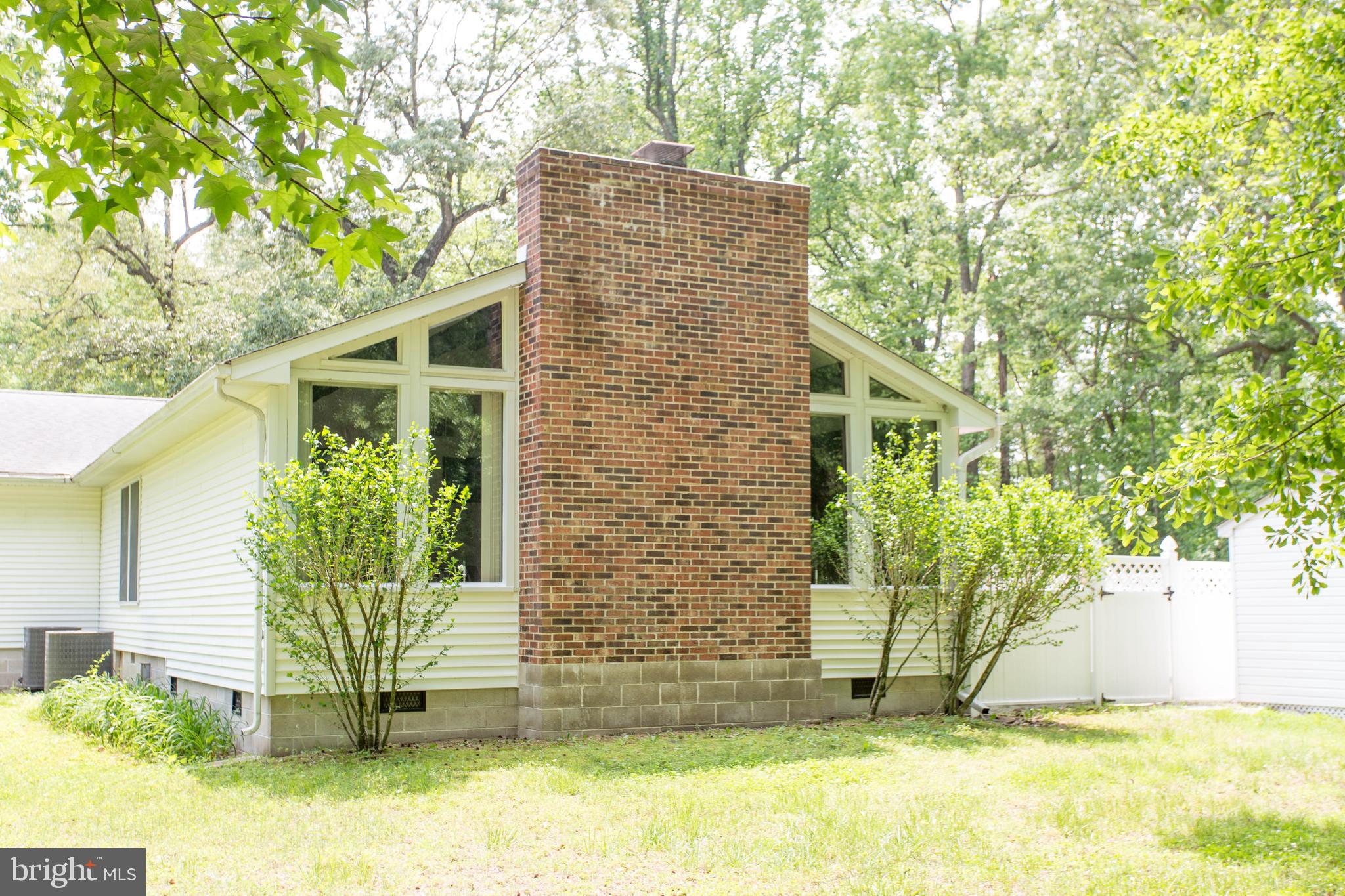 22167 Melson Road Georgetown, DE 19947 - Photo 35 of 38 a view of a house with backyard and a tree