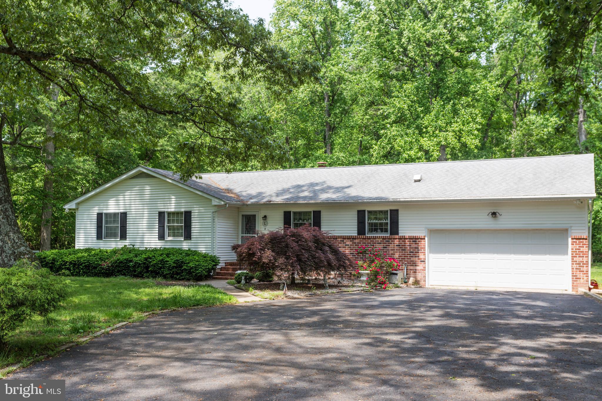 22167 Melson Road Georgetown, DE 19947 - Photo 37 of 38 a front view of house with yard and trees