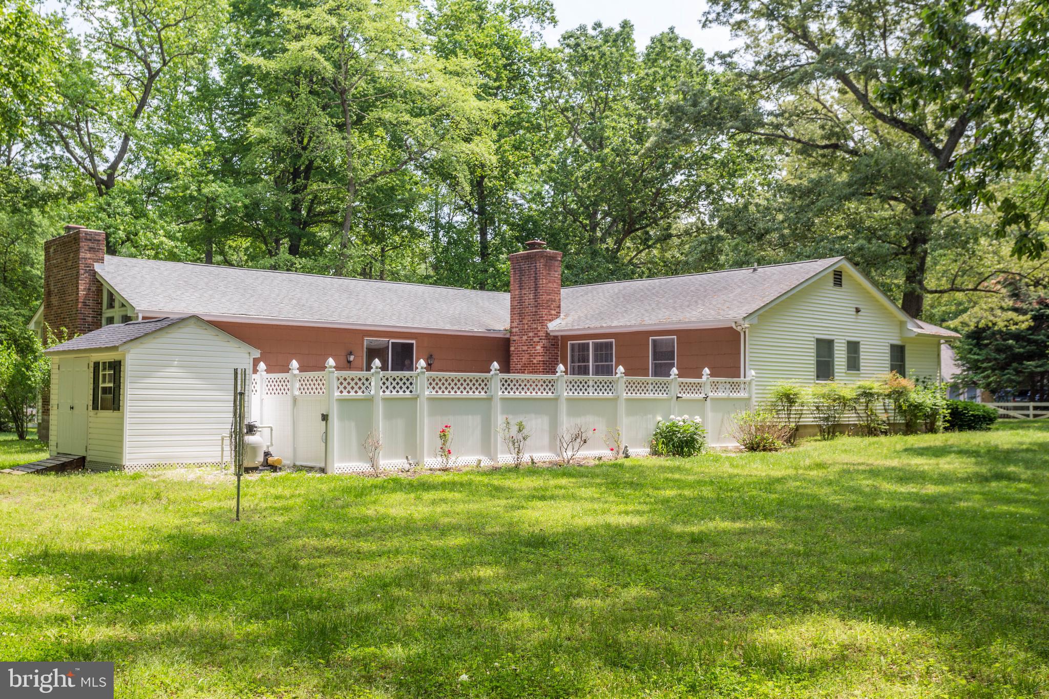 22167 Melson Road Georgetown, DE 19947 - Photo 10 of 38 a front view of a house with a yard