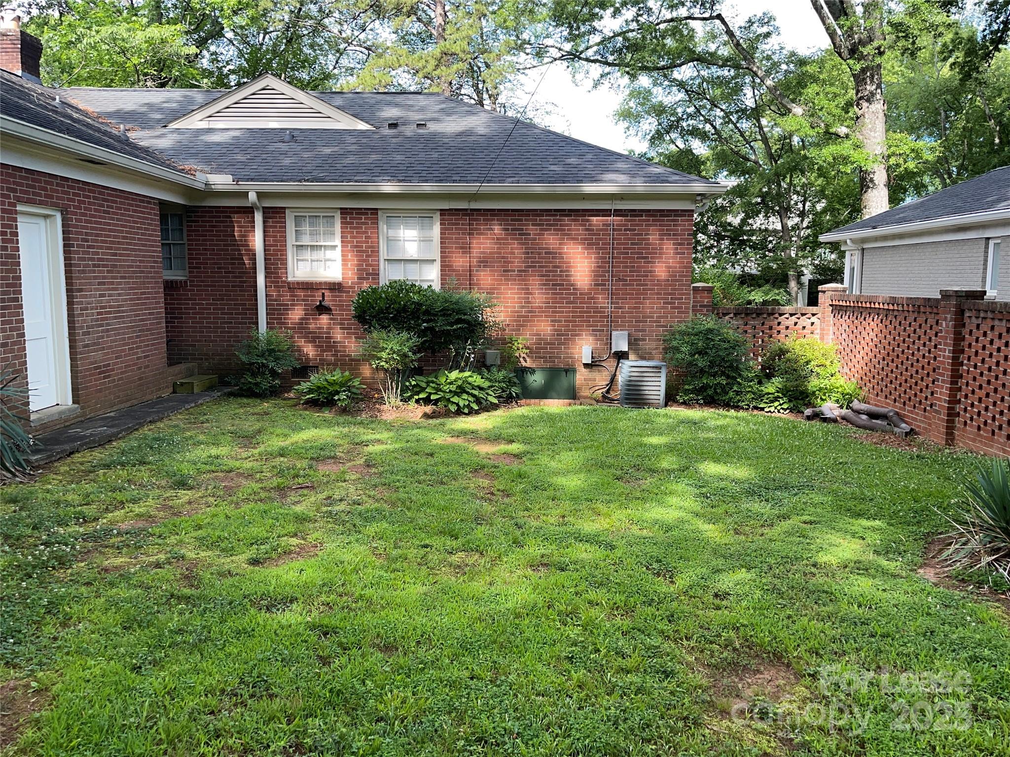 2518 Westfield Road Charlotte, NC 28209 - Photo 16 of 19 a front view of a house with garden