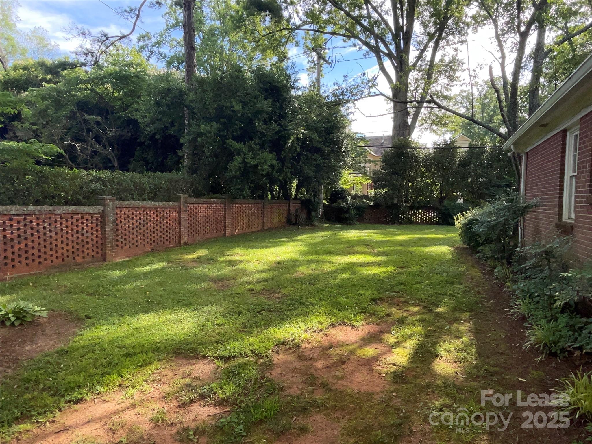 2518 Westfield Road Charlotte, NC 28209 - Photo 18 of 19 a view of a tennis ground with large trees