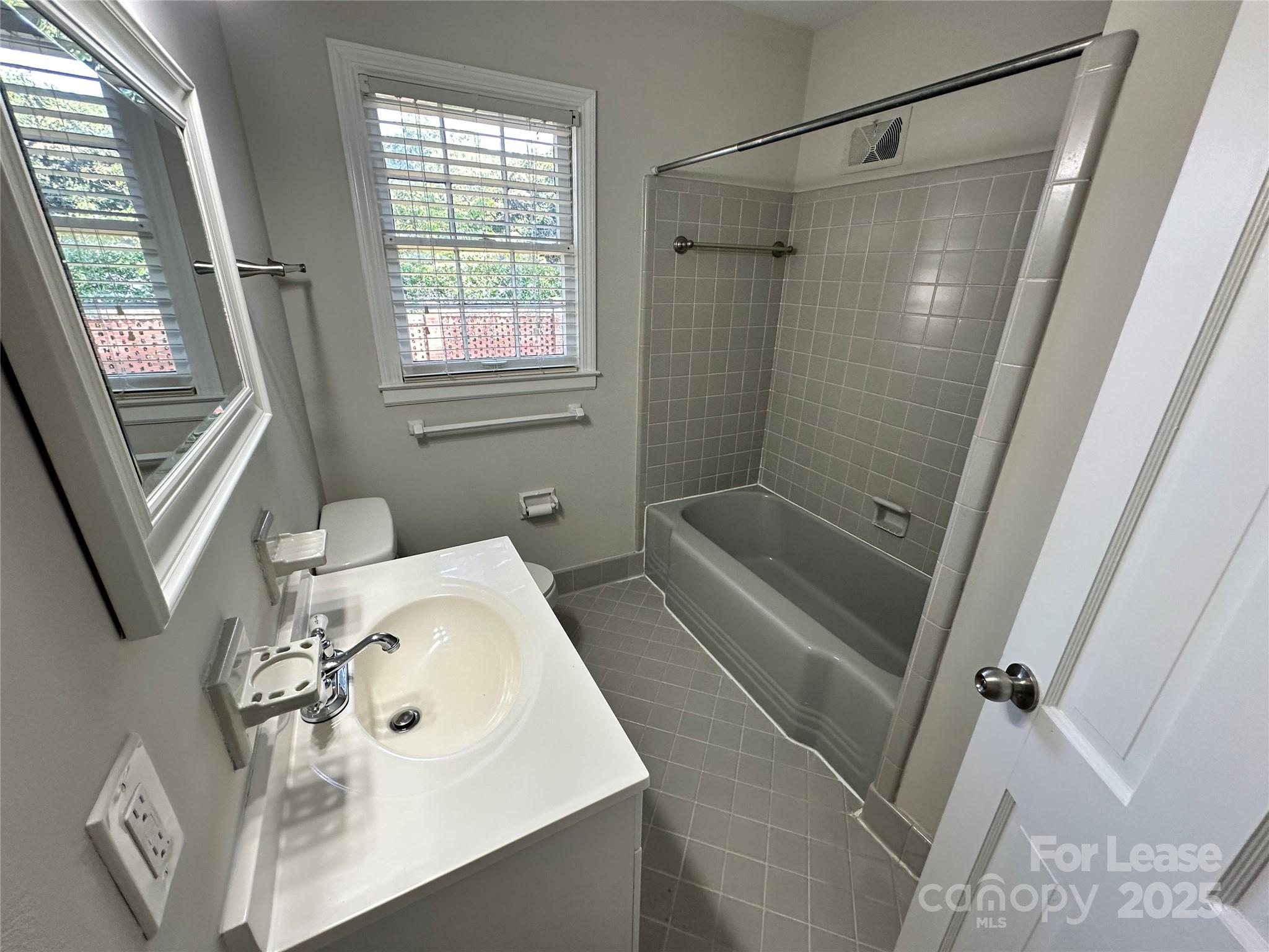 2518 Westfield Road Charlotte, NC 28209 - Photo 10 of 19 a bathroom with a sink and a shower