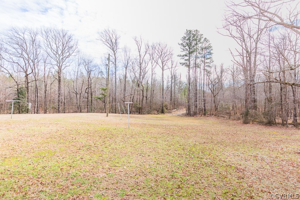 8900 Doss Road Moseley, VA 23120 - Photo 39 of 48 a view of swimming pool with an outdoor space and seating area