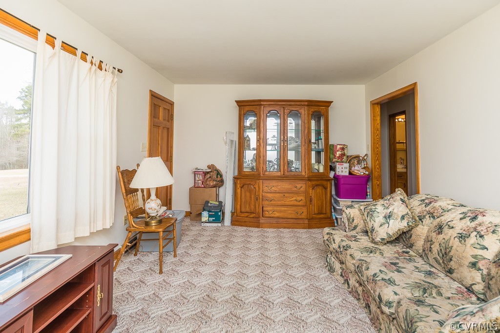 8900 Doss Road Moseley, VA 23120 - Photo 5 of 48 a bed room with a bed and a chair