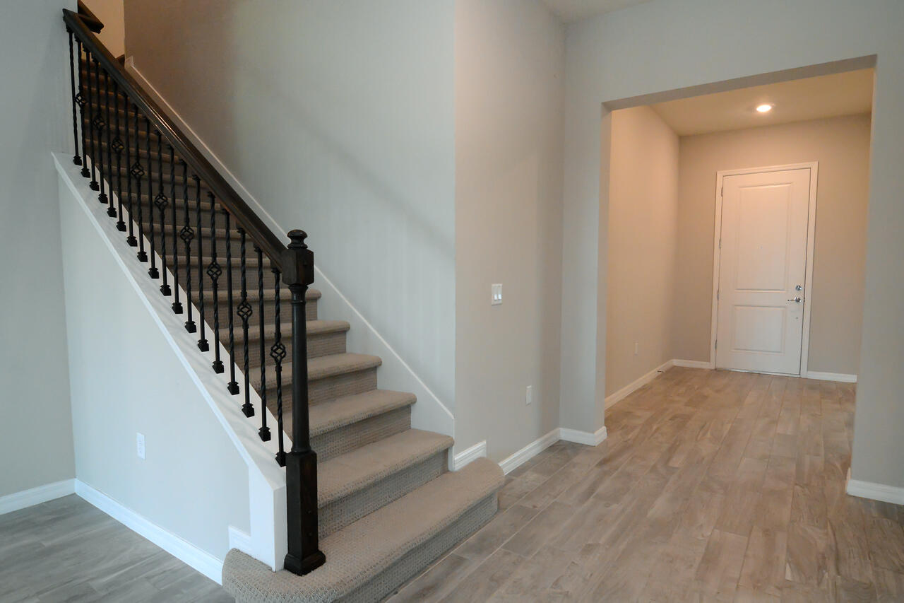 902 Foal Point Oviedo, FL 32765 - Photo 16 of 35 a view of staircase with wooden floor and white walls