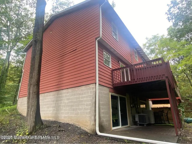 a view of a house with a yard and wooden floor