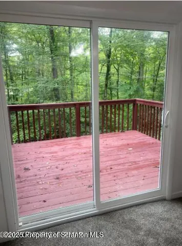 a view of balcony with wooden floor