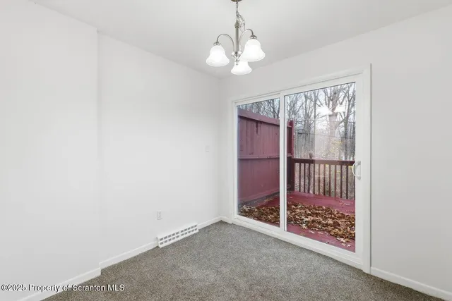 a picture of a bench in front of a wall