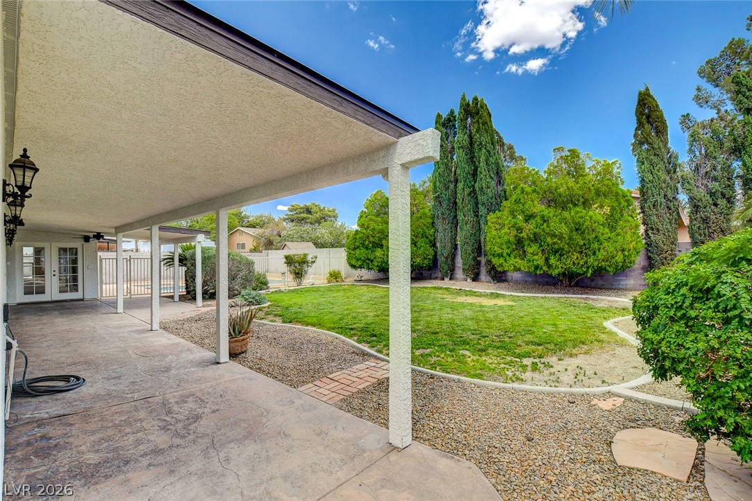 1810 Pinto Road Henderson, NV 89002 - Photo 41 of 53 An inviting covered patio opens to a manicured yard, perfect for outdoor enjoyment.
