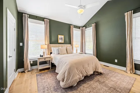 a bedroom with a bed and a couch