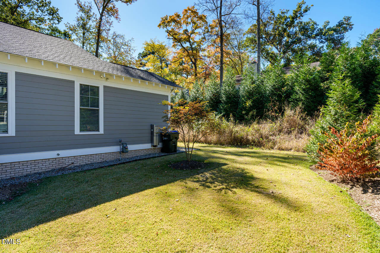 1905 Milan Street Durham, NC 27704 - Photo 34 of 42 a view of a backyard with plants and large trees