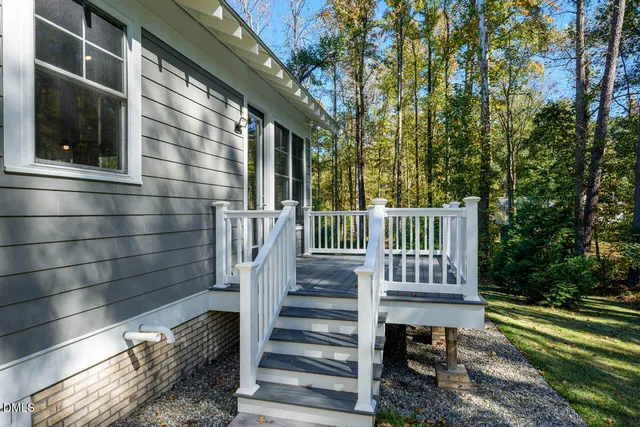 a view of a balcony with wooden floor