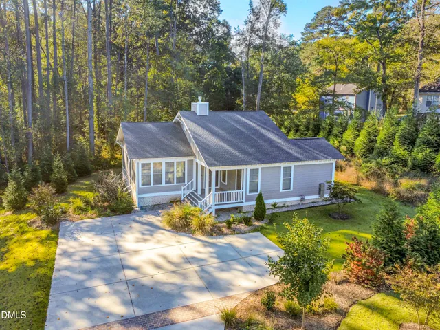 a house with trees in the background