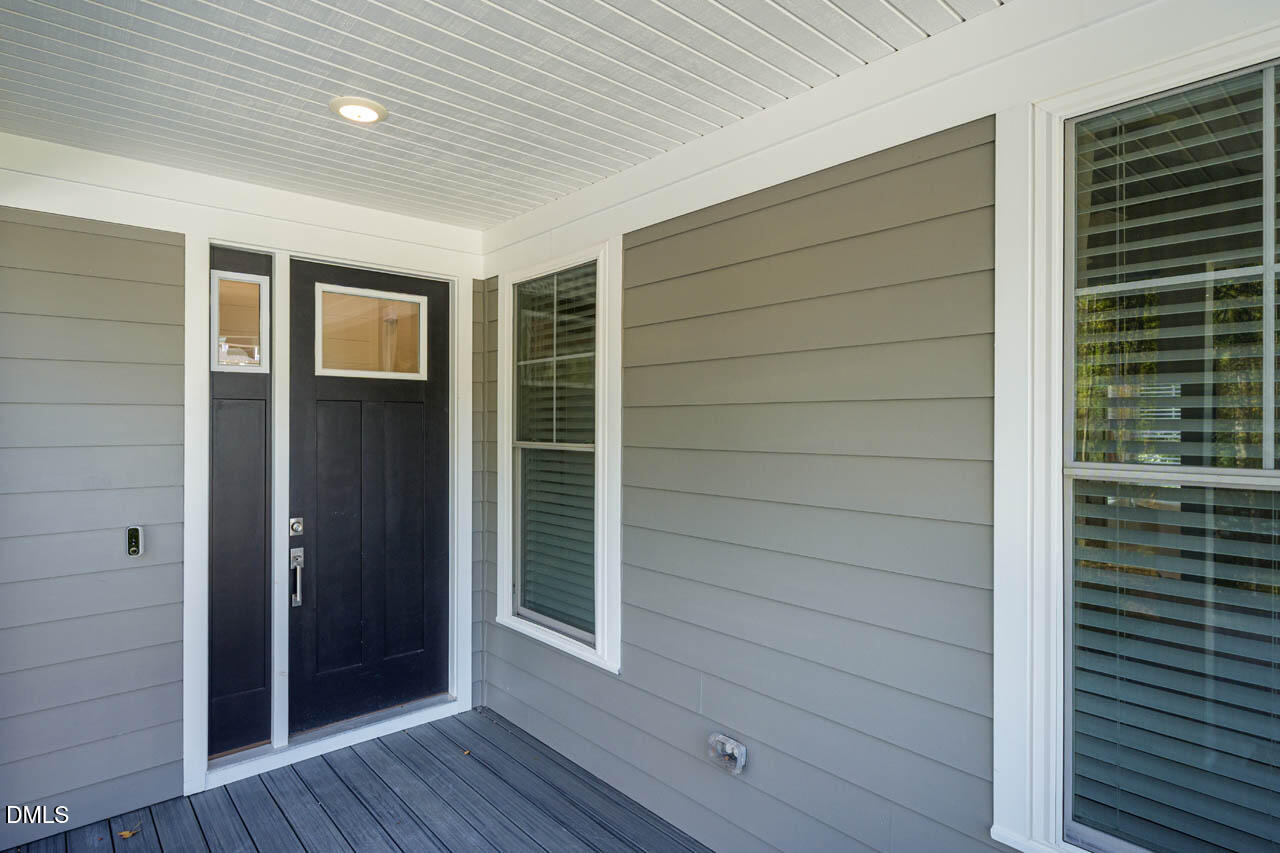 1905 Milan Street Durham, NC 27704 - Photo 3 of 42 a view of front door and wooden walk in closet