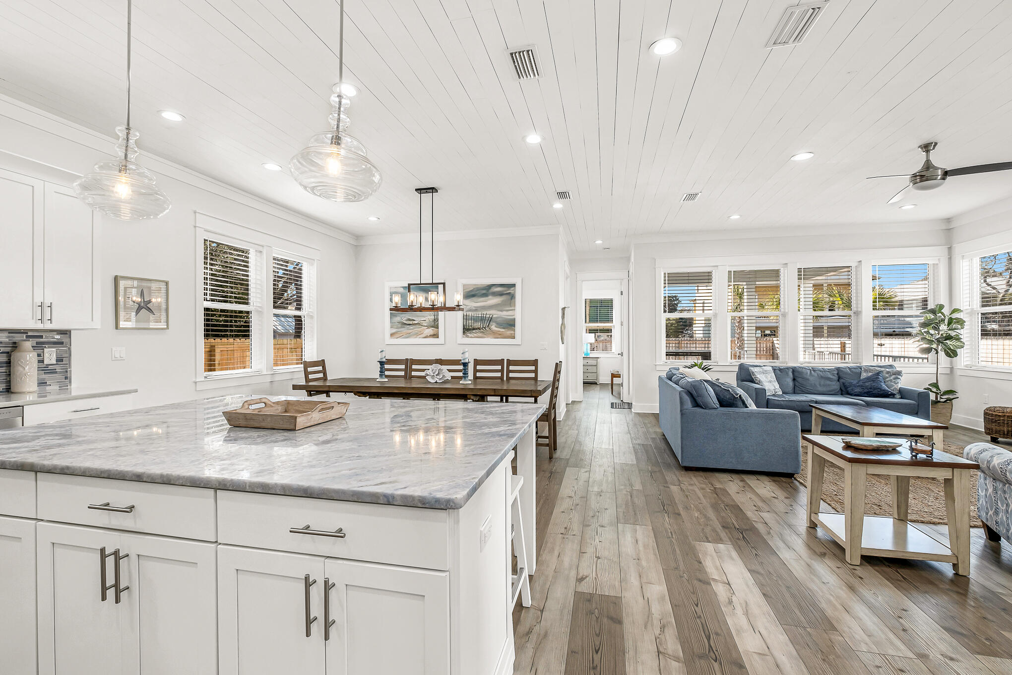 80 Sunfish Street Destin, FL 32541 - Photo 12 of 51 a living room with kitchen island furniture and a wooden floor